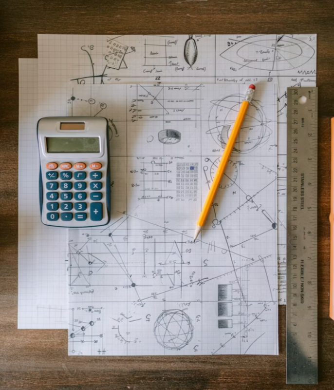 Chalkboard covered with mathematical formulas and equations.