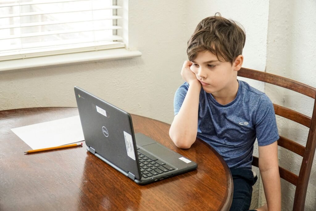 A student receiving online tutoring on a computer.