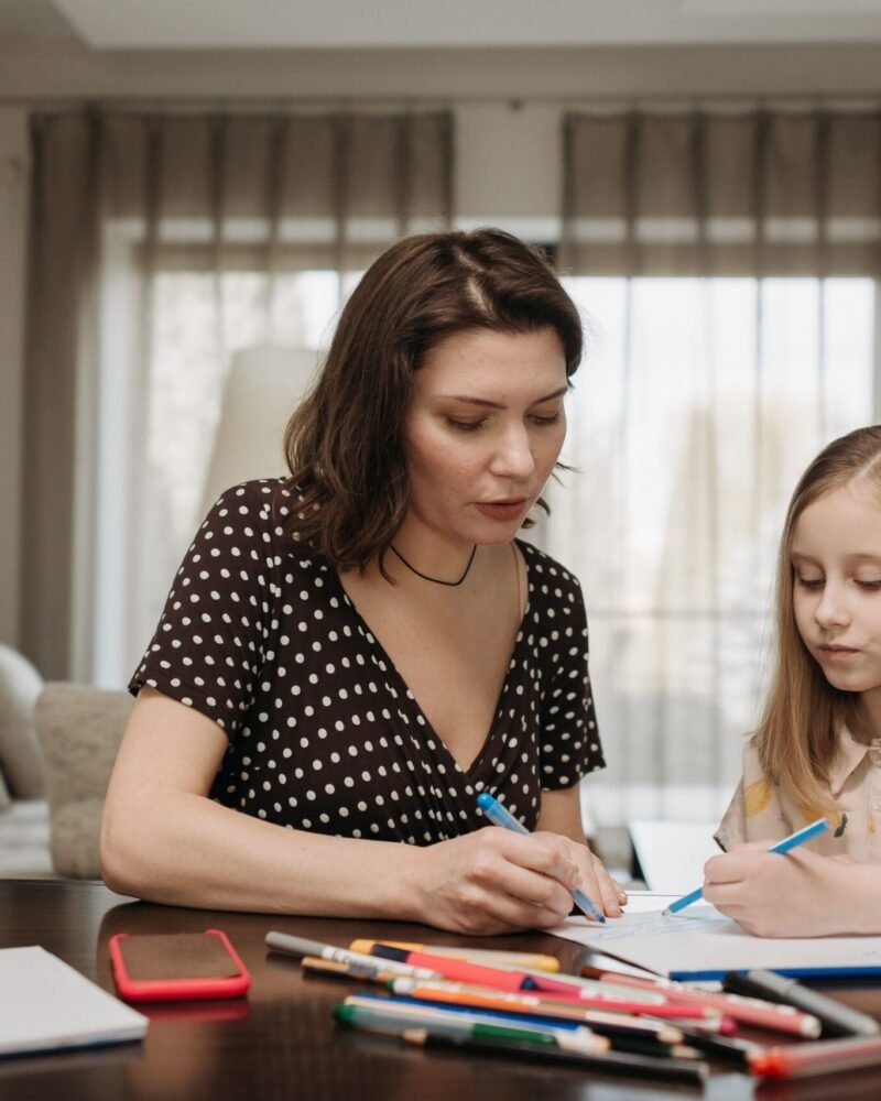 A tutor working with a student during a lesson.